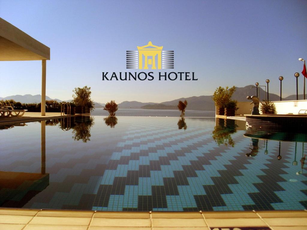 a view of a swimming pool in a hotel at Kaunos Hotel in Koycegiz