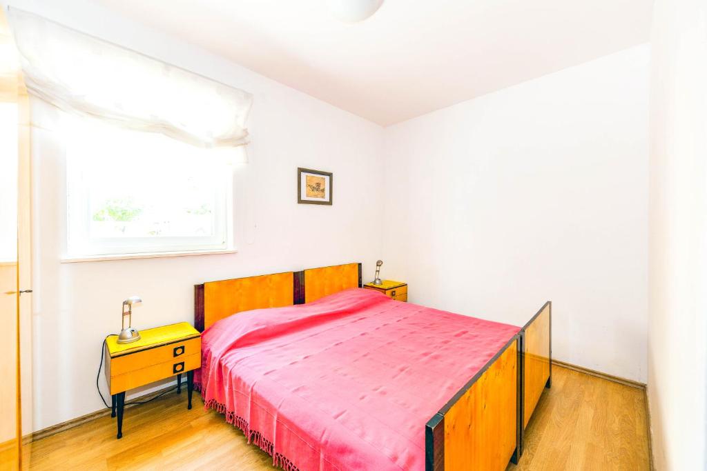 Postel nebo postele na pokoji v ubytování Apartments Silvia