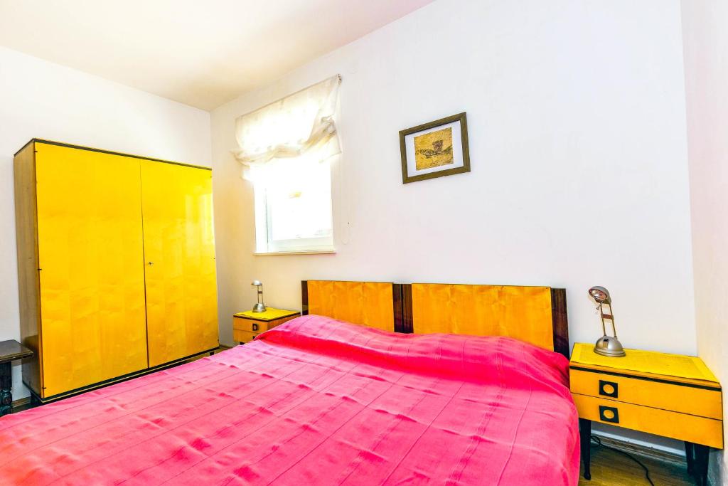 Postel nebo postele na pokoji v ubytování Apartments Silvia