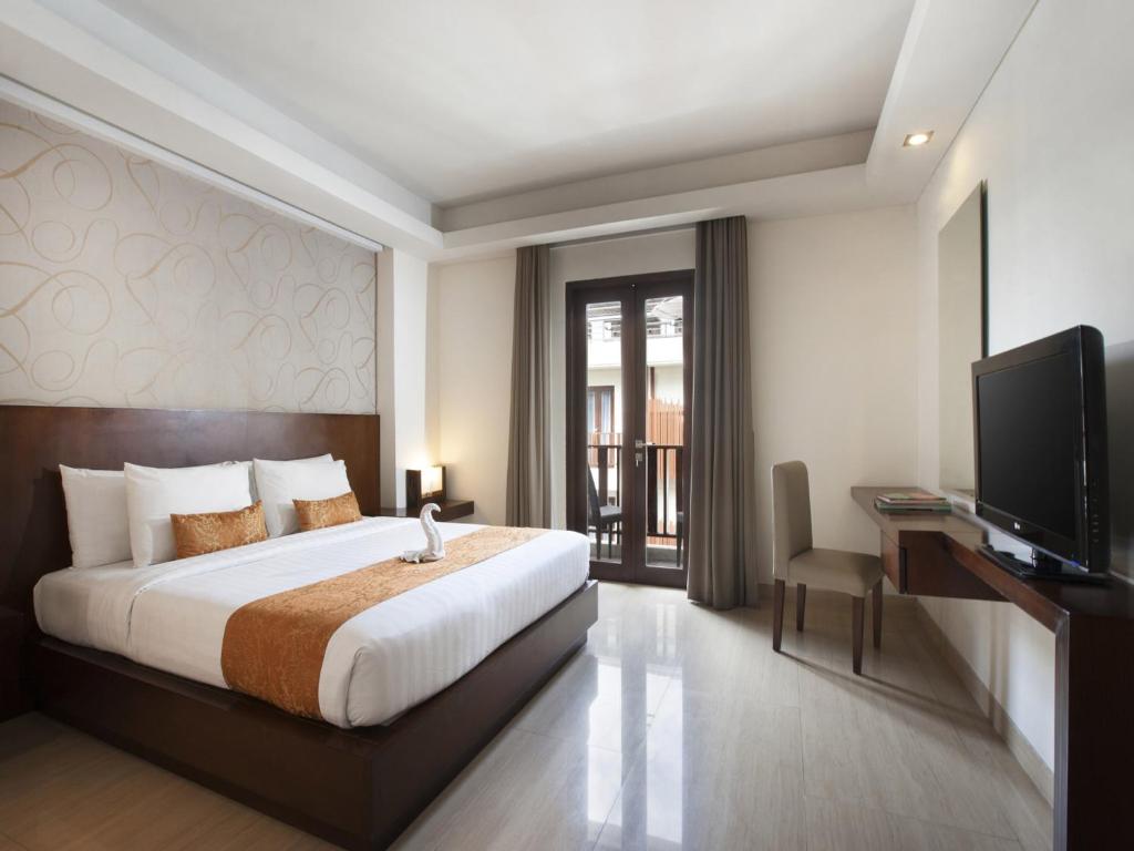 Postel nebo postele na pokoji v ubytování d'primahotel Seminyak