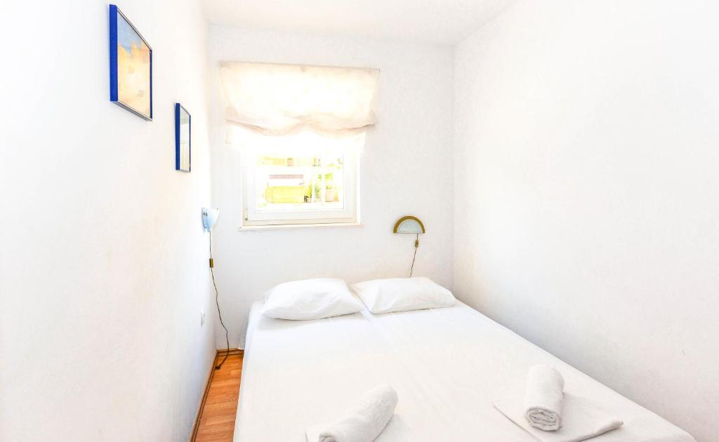 Postel nebo postele na pokoji v ubytování Apartments Silvia
