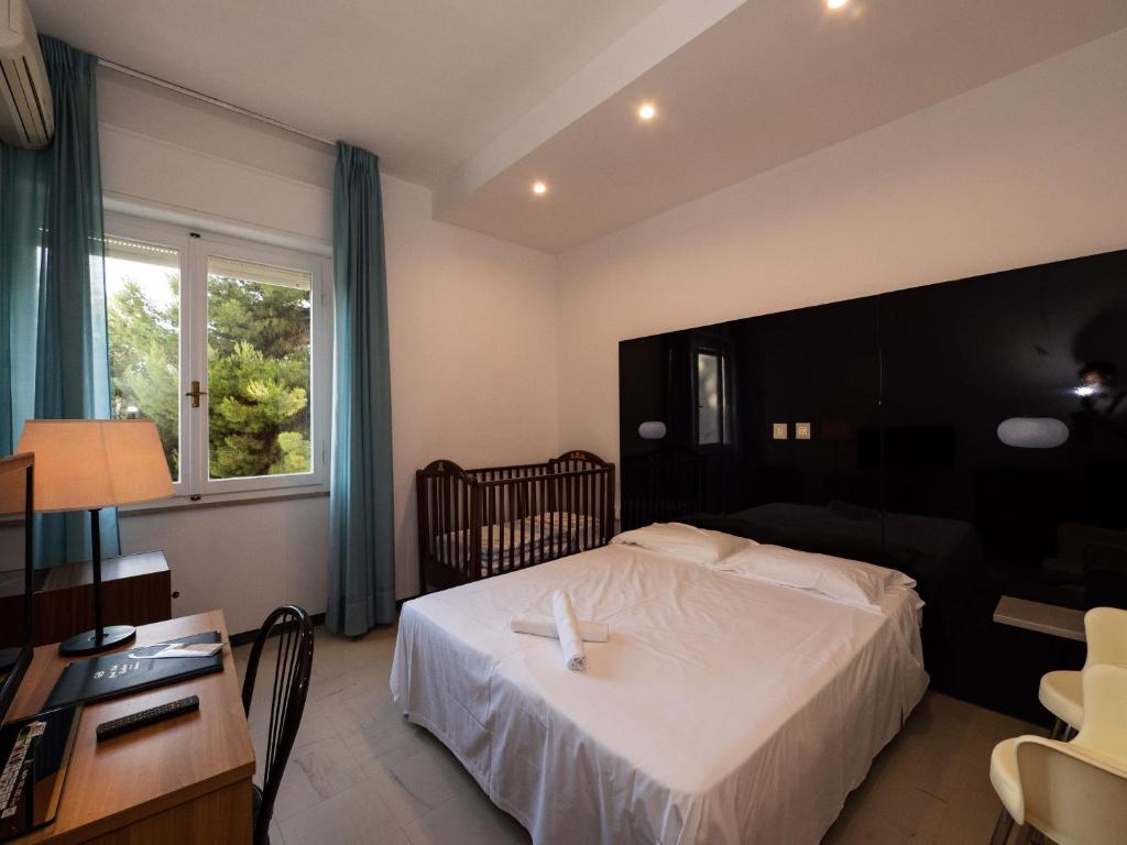 Una cama o camas en una habitación de Grand Hotel Excelsior