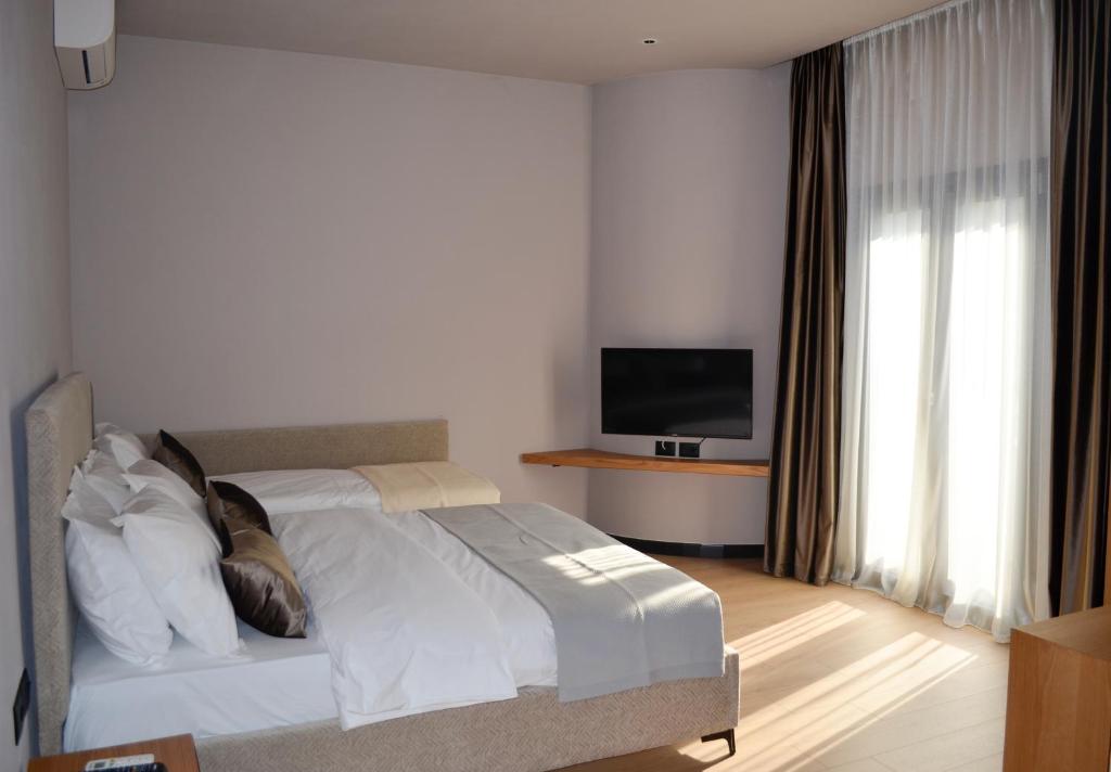 Postel nebo postele na pokoji v ubytování N'Peze Hotel