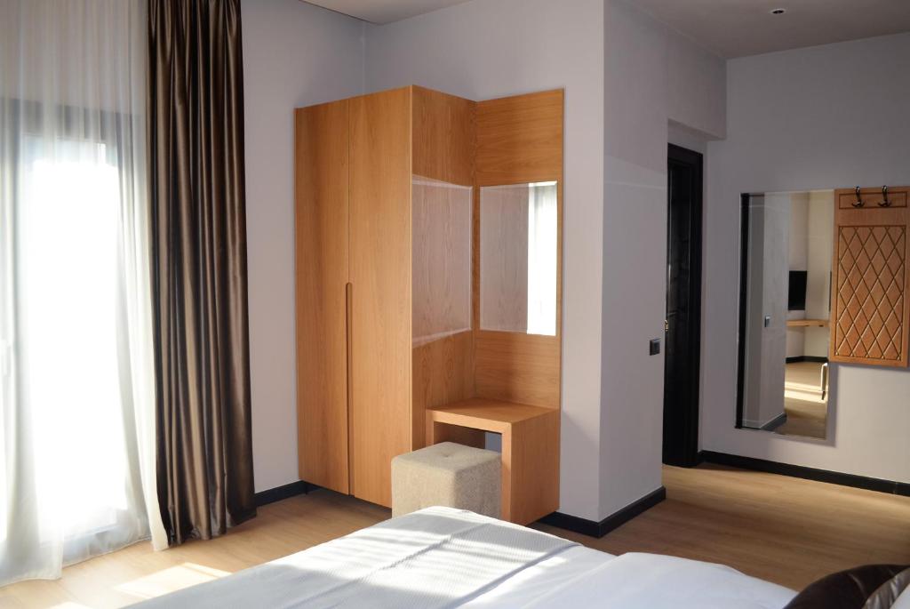 Postel nebo postele na pokoji v ubytování N'Peze Hotel