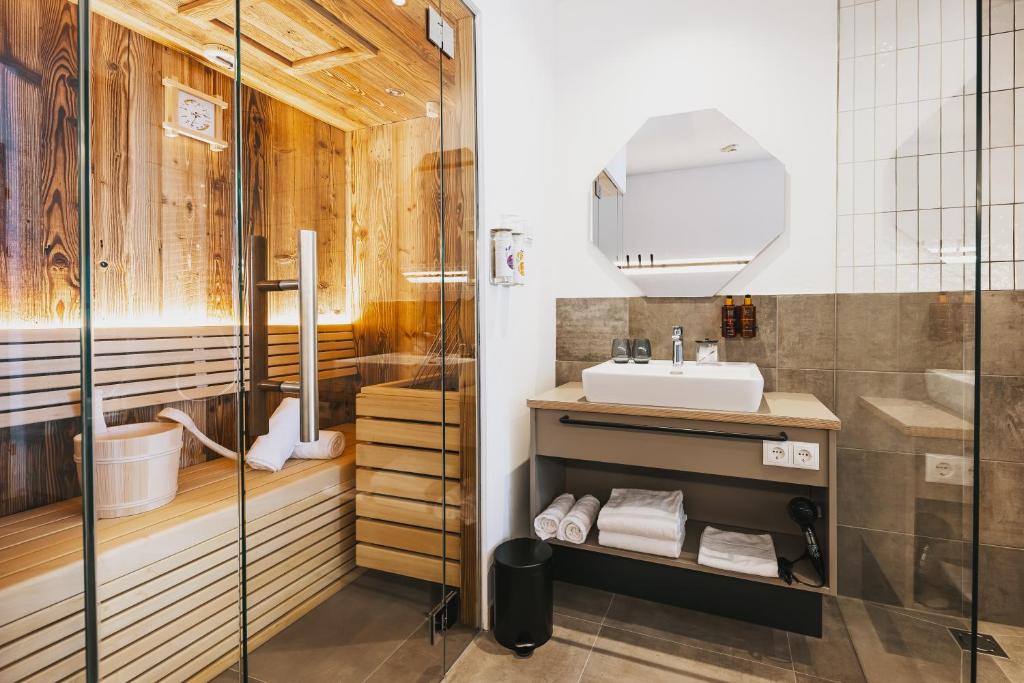 A bathroom at Nikolaus by AvenidA Panoramic Wellness Suites