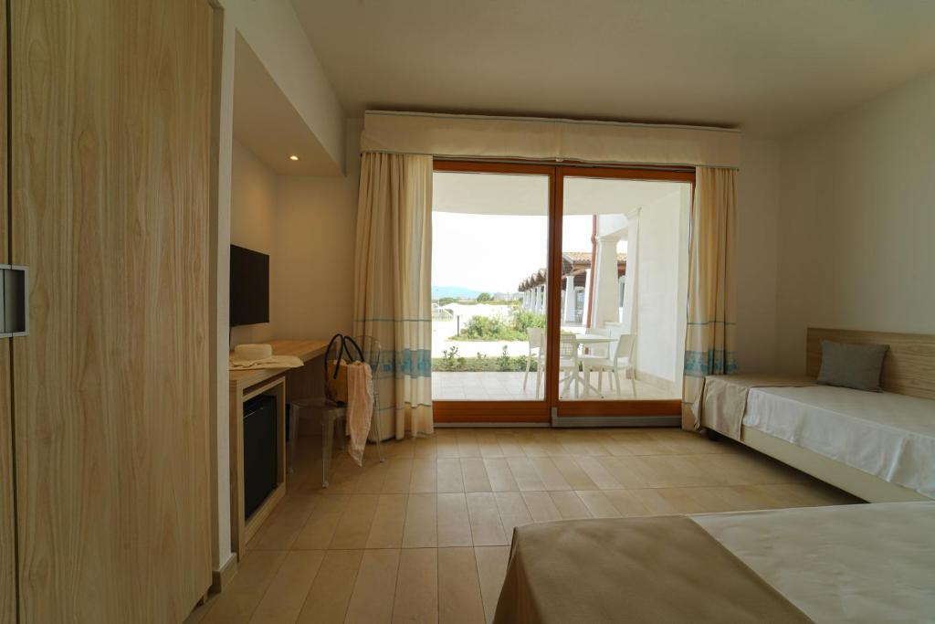 Postel nebo postele na pokoji v ubytování GH Santina Resort & SPA