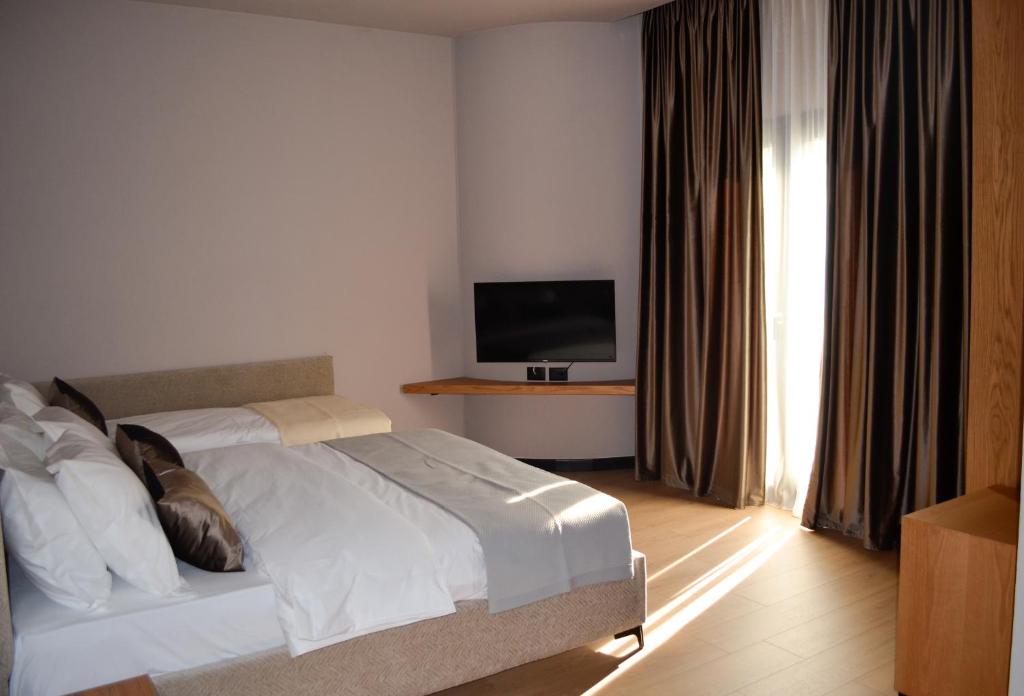 Postel nebo postele na pokoji v ubytování N'Peze Hotel