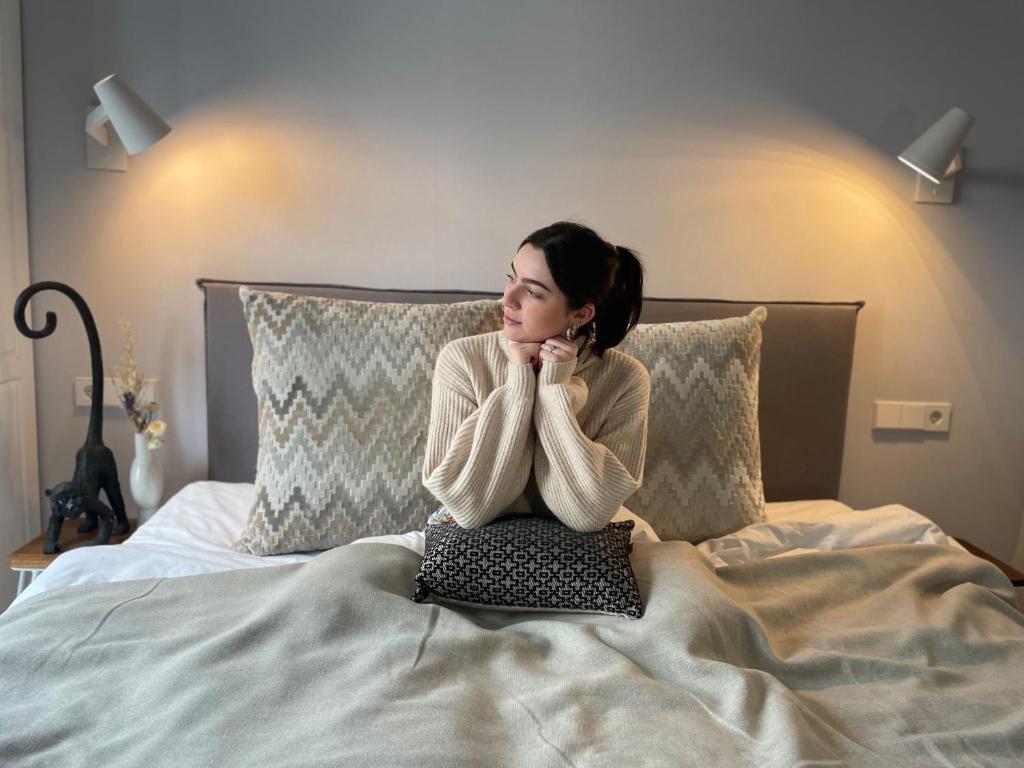 Postel nebo postele na pokoji v ubytování Stadsvilla Hotel Mozaic Den Haag