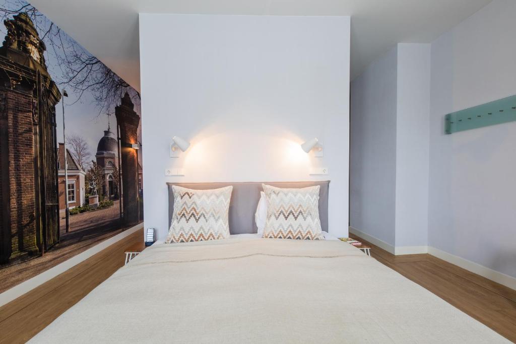 Postel nebo postele na pokoji v ubytování Stadsvilla Hotel Mozaic Den Haag
