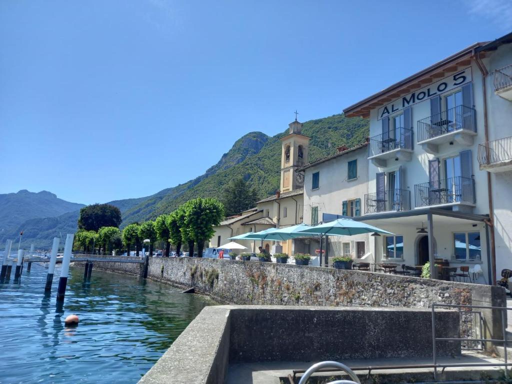 a view of a river with buildings and a town at Al Molo 5 - Lake Front in Oliveto Lario