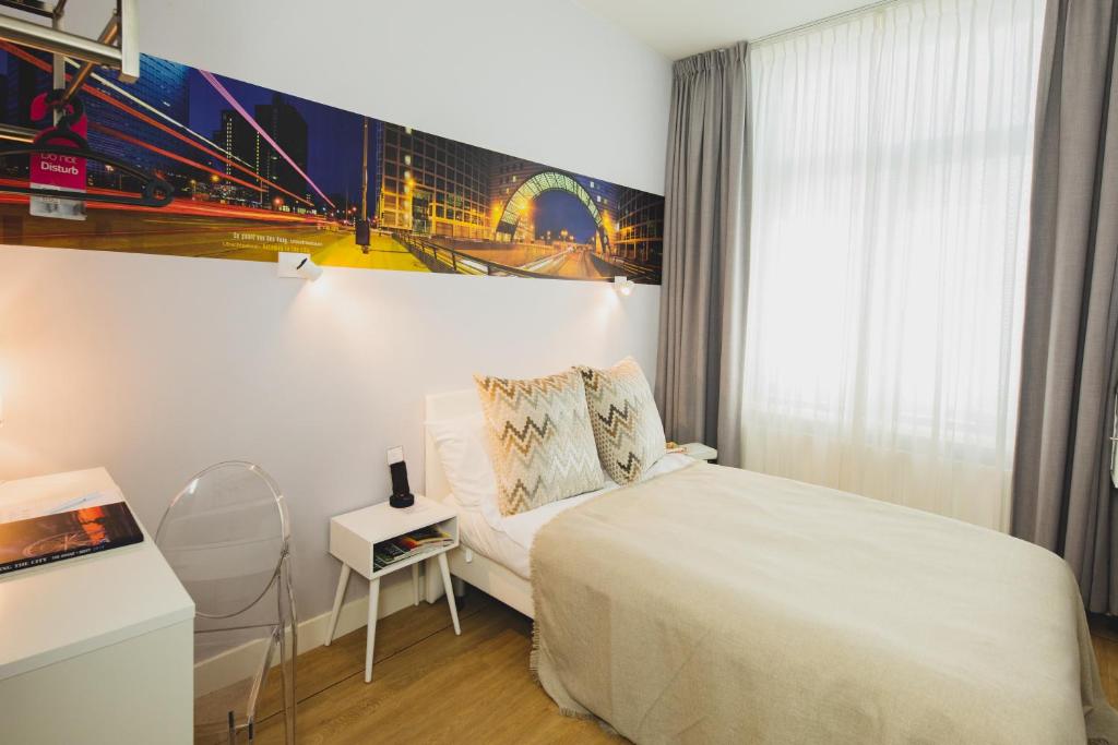Postel nebo postele na pokoji v ubytování Stadsvilla Hotel Mozaic Den Haag