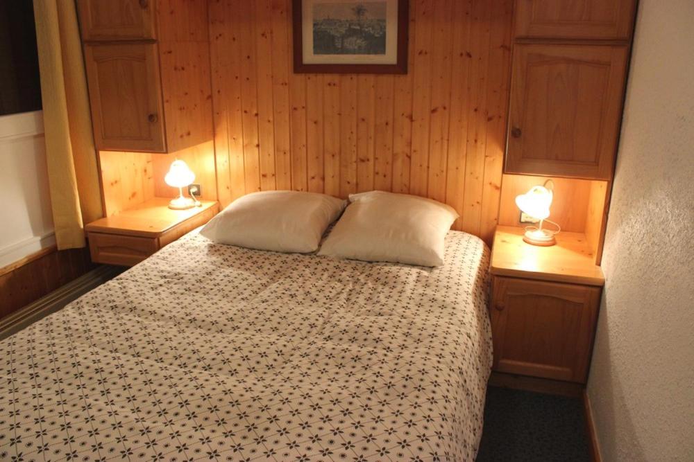 Postel nebo postele na pokoji v ubytování Trois Vallées Appartements VTI