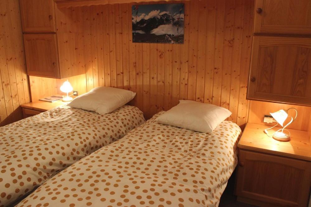 Postel nebo postele na pokoji v ubytování Trois Vallées Appartements VTI