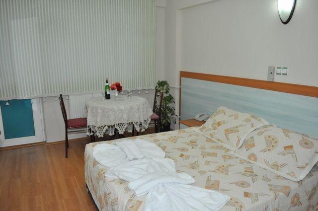 Postel nebo postele na pokoji v ubytování Uyum Hotel