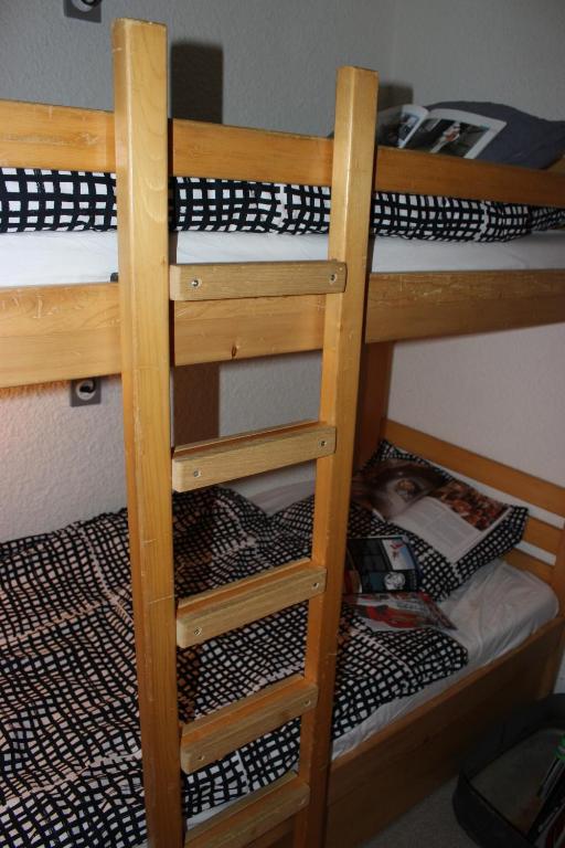 Palanda nebo palandy na pokoji v ubytování Trois Vallées Appartements VTI
