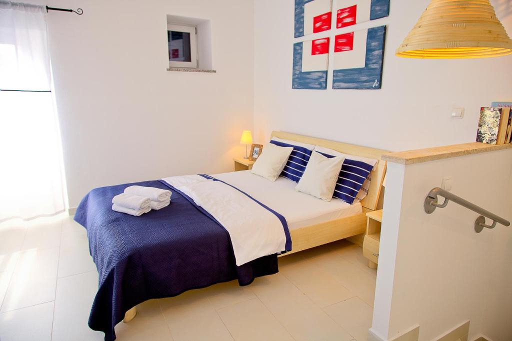 Postel nebo postele na pokoji v ubytování Apartments Stefani