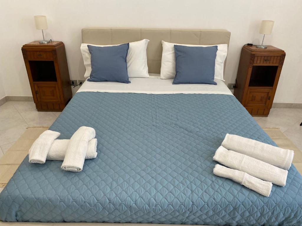 Postel nebo postele na pokoji v ubytování Casa vacanze Nonno Iano