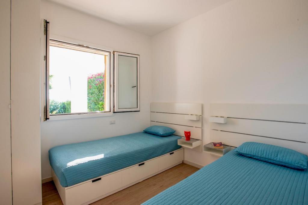 Voodi või voodid majutusasutuse I Giardini di Athena- Athena Resort toas