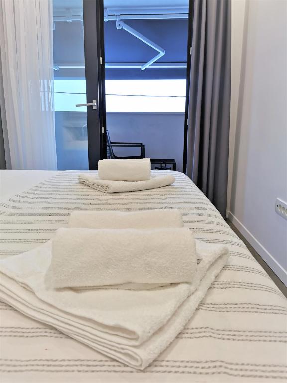 Posteľ alebo postele v izbe v ubytovaní Apartment Lola