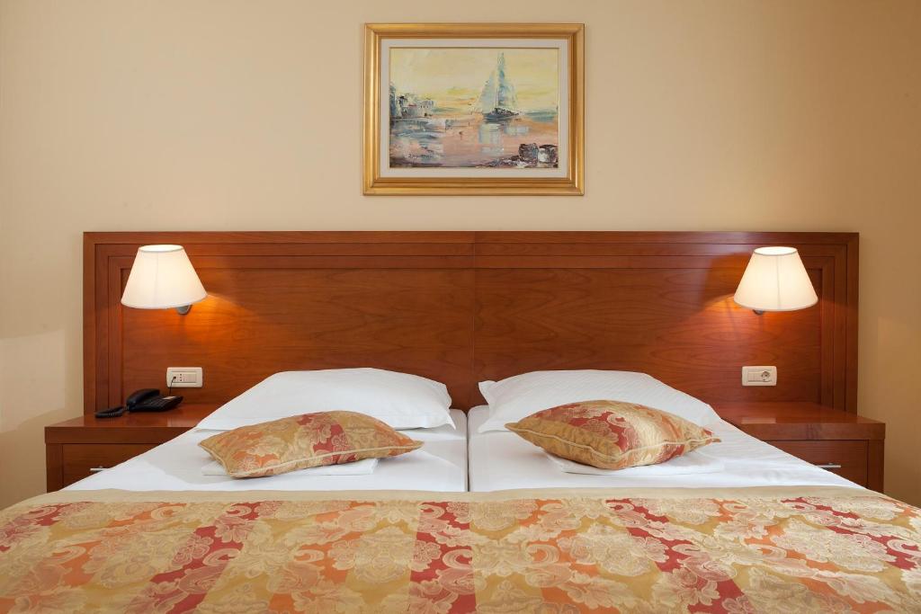 Postel nebo postele na pokoji v ubytování Hotel Bella Vista