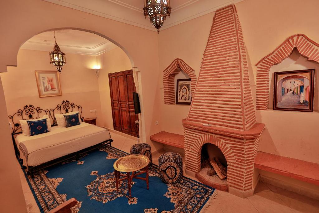 Postel nebo postele na pokoji v ubytování Riad Catalina