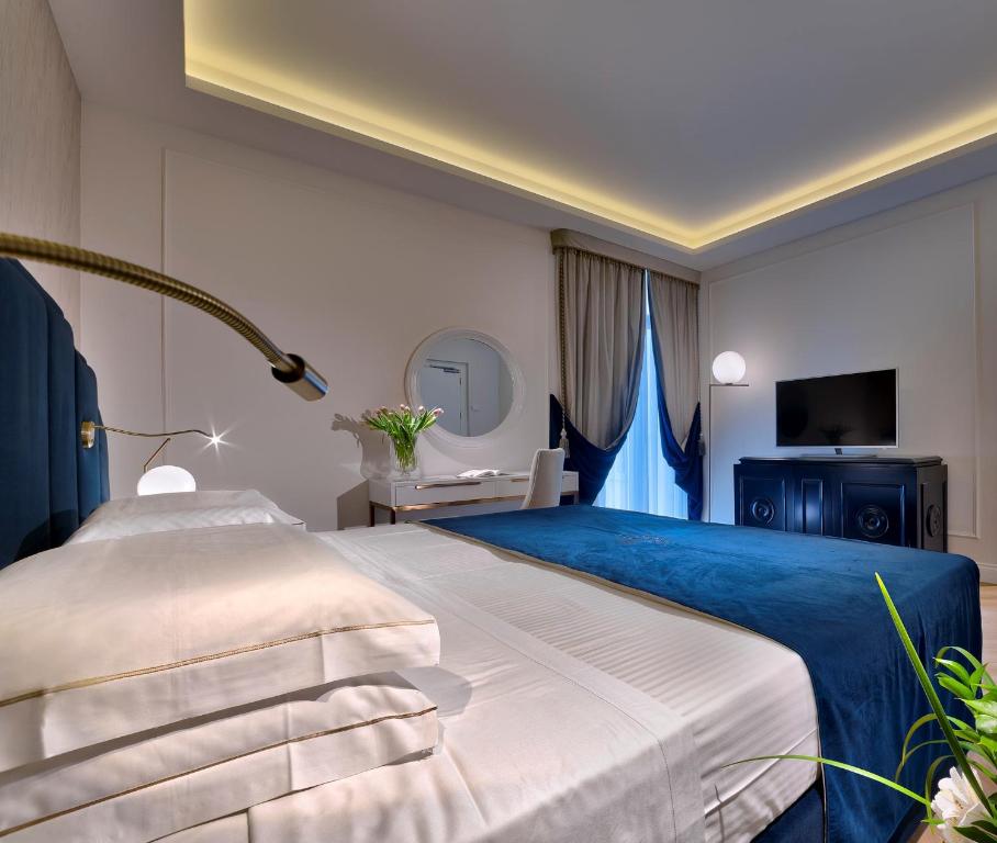 Postel nebo postele na pokoji v ubytování Hotel Premiere Abano