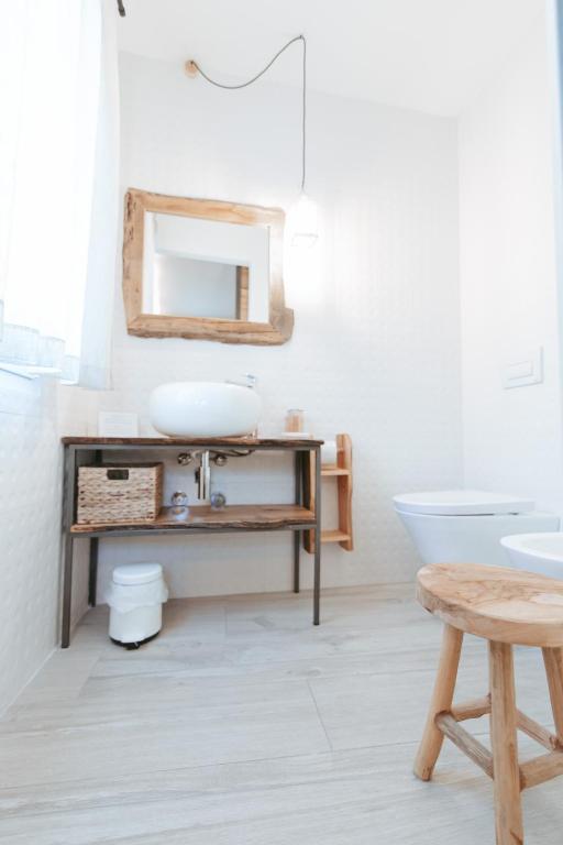 a bathroom with a sink and a mirror at Laguna Suite B&B in Chioggia