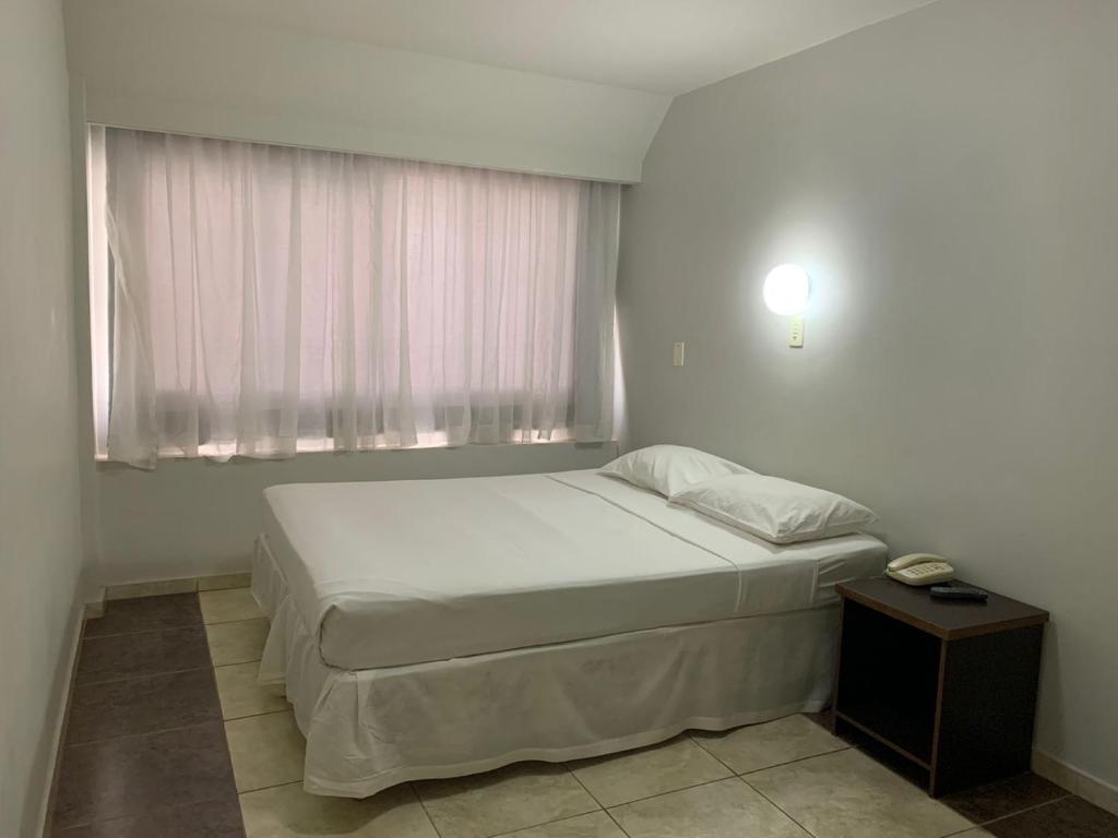 Postel nebo postele na pokoji v ubytování Hotel Doral Apucarana