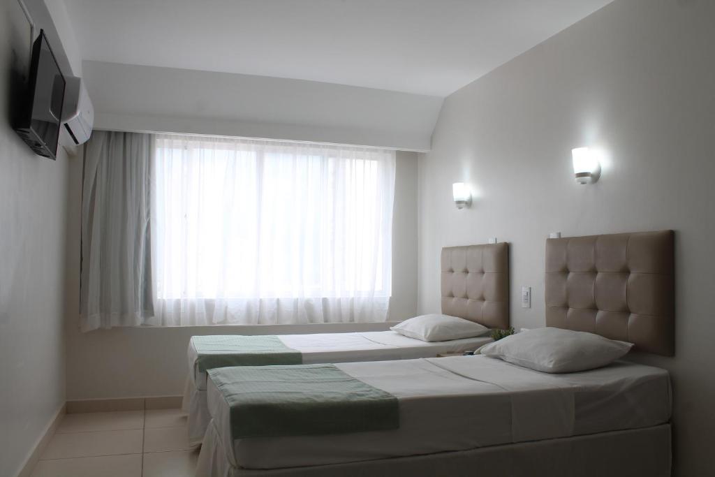Postel nebo postele na pokoji v ubytování Hotel Doral Apucarana