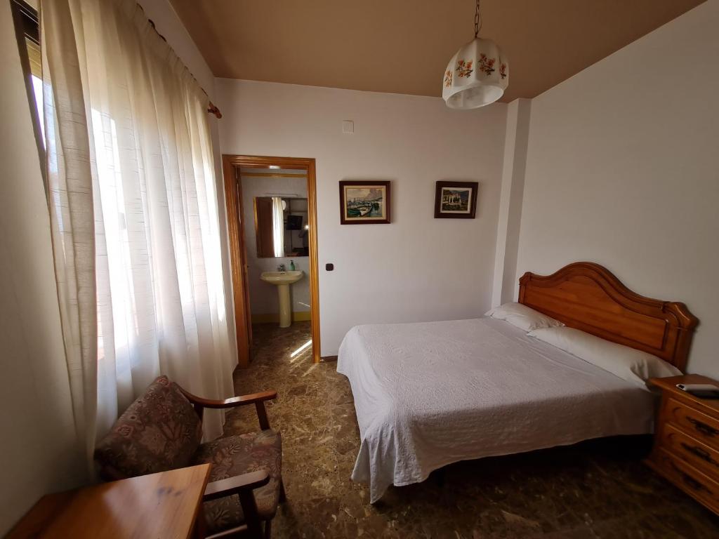 Postel nebo postele na pokoji v ubytování Hotel Bon Lloc