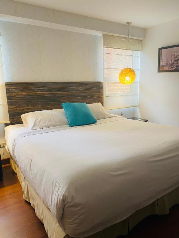 Postel nebo postele na pokoji v ubytování Hotel Retiro 84 by MIJ
