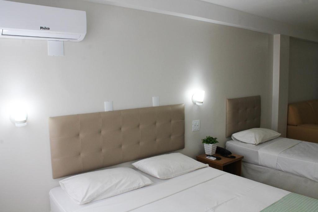 Postel nebo postele na pokoji v ubytování Hotel Doral Apucarana