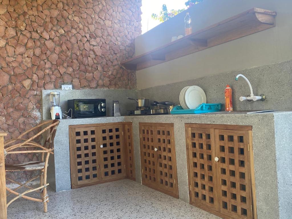 Kuchyň nebo kuchyňský kout v ubytování Mbuyuni Beach Village