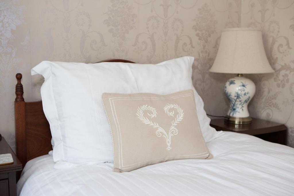 Postel nebo postele na pokoji v ubytování Riverdale House B&B