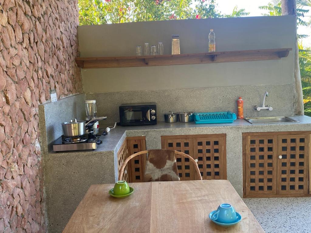 Kuchyň nebo kuchyňský kout v ubytování Mbuyuni Beach Village