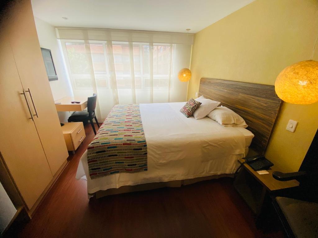 Postel nebo postele na pokoji v ubytování Hotel Retiro 84 by MIJ