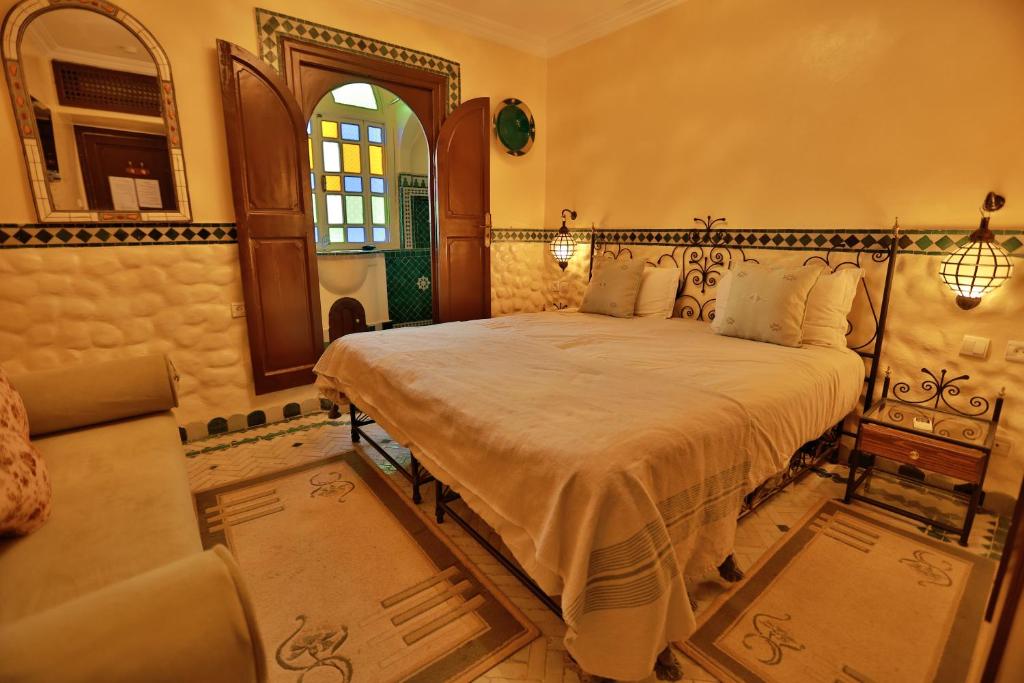 Postel nebo postele na pokoji v ubytování Riad Catalina