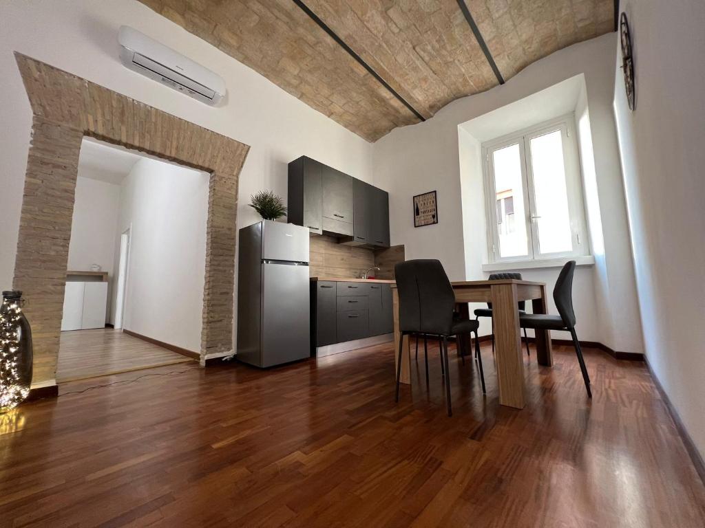 A kitchen or kitchenette at StarHome Colosseo