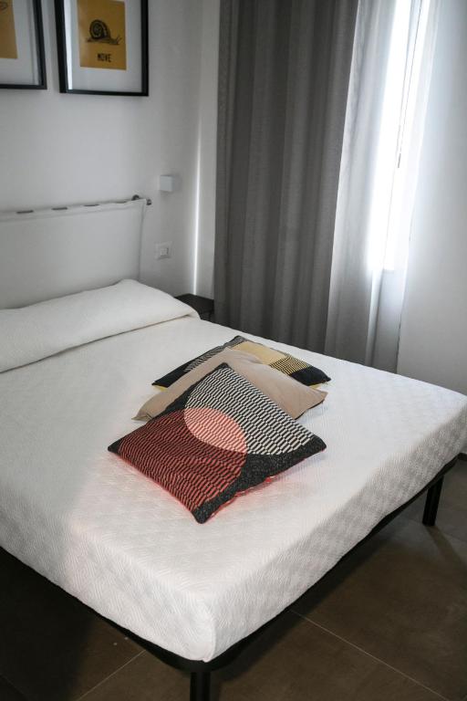 Posteľ alebo postele v izbe v ubytovaní Via Del Faro Apartments