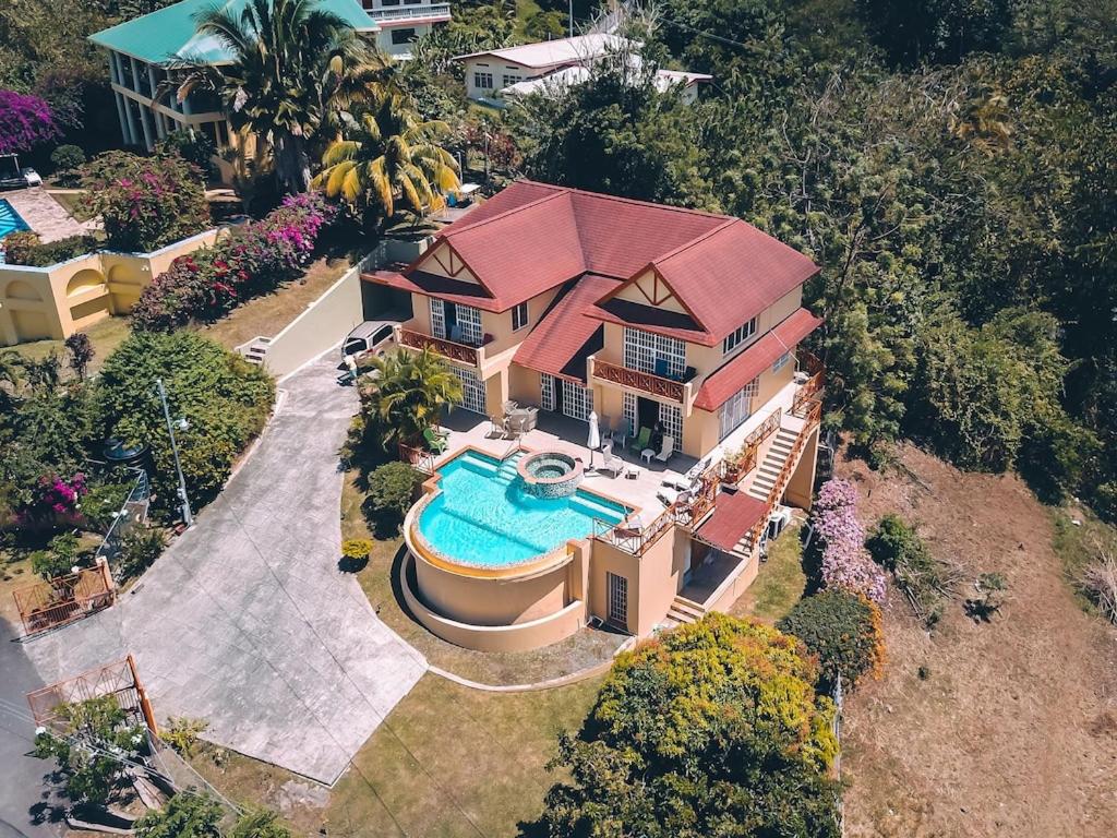 an overhead view of a house with a swimming pool at La Jolie - Luxury Ocean View Villa in Black Rock