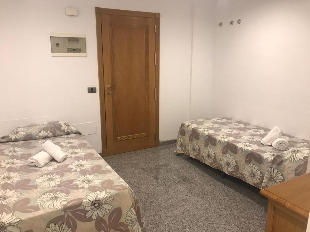Postel nebo postele na pokoji v ubytování Ake