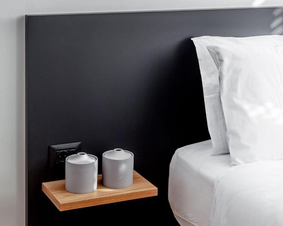 Postel nebo postele na pokoji v ubytování DeBlox living - Ben Avigdor Apartments