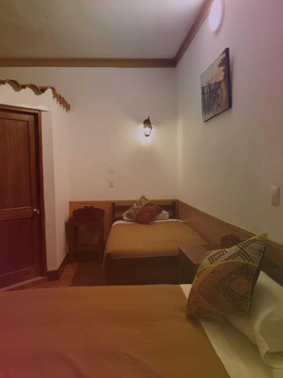 Voodi või voodid majutusasutuse Terra Sagrada Cusco toas