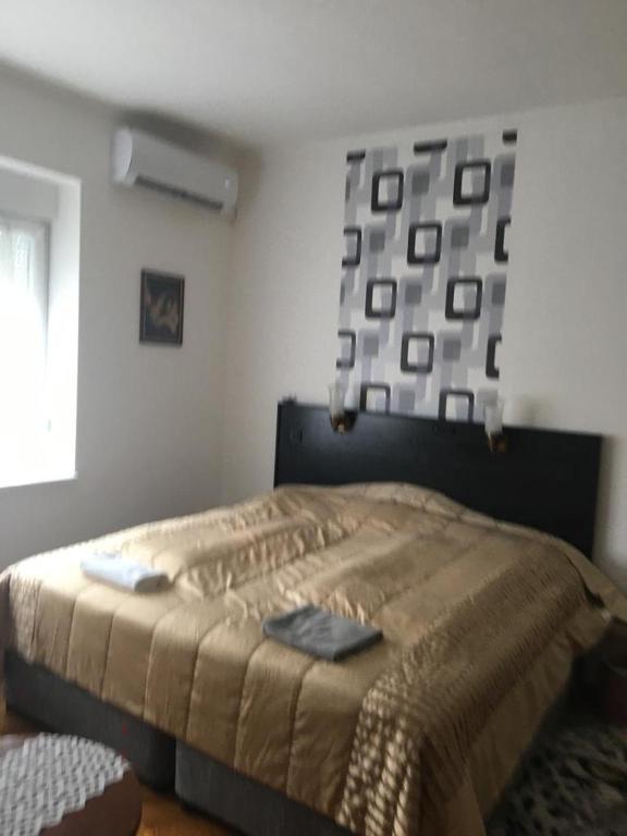 Postel nebo postele na pokoji v ubytování Dombi Porta