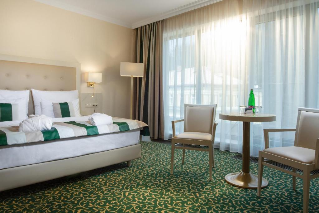 Postel nebo postele na pokoji v ubytování Grandhotel Nabokov