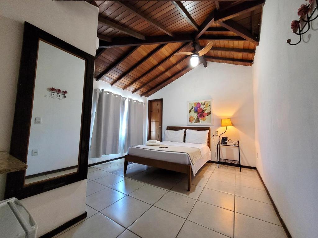a bedroom with a bed in a room at Centro Up! in Búzios
