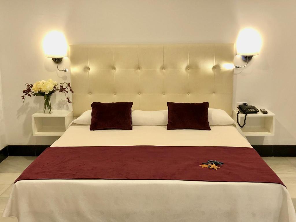 Postel nebo postele na pokoji v ubytování Hotel Océano Centro