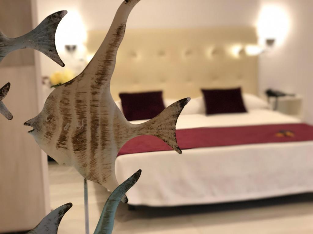 Postel nebo postele na pokoji v ubytování Hotel Océano Centro