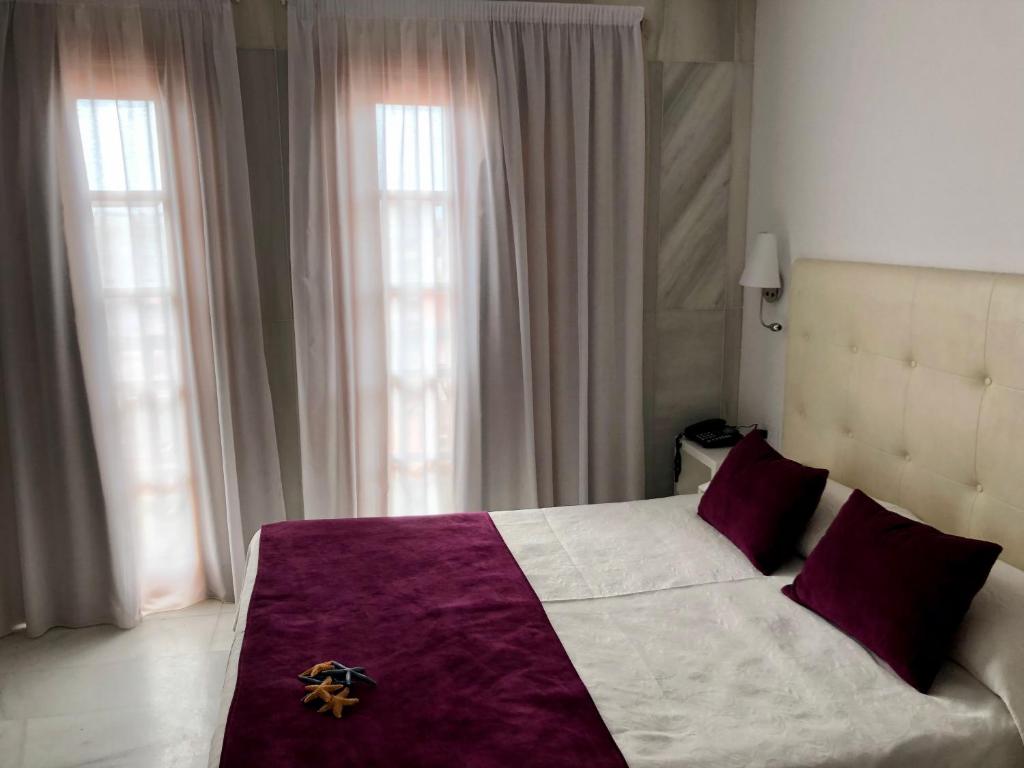 Postel nebo postele na pokoji v ubytování Hotel Océano Centro