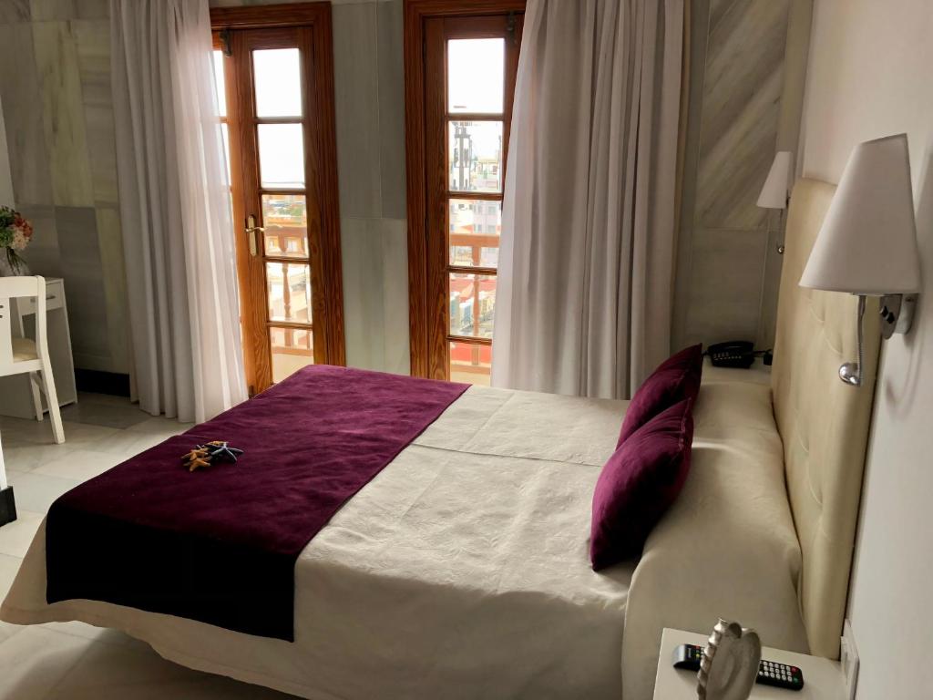 Postel nebo postele na pokoji v ubytování Hotel Océano Centro